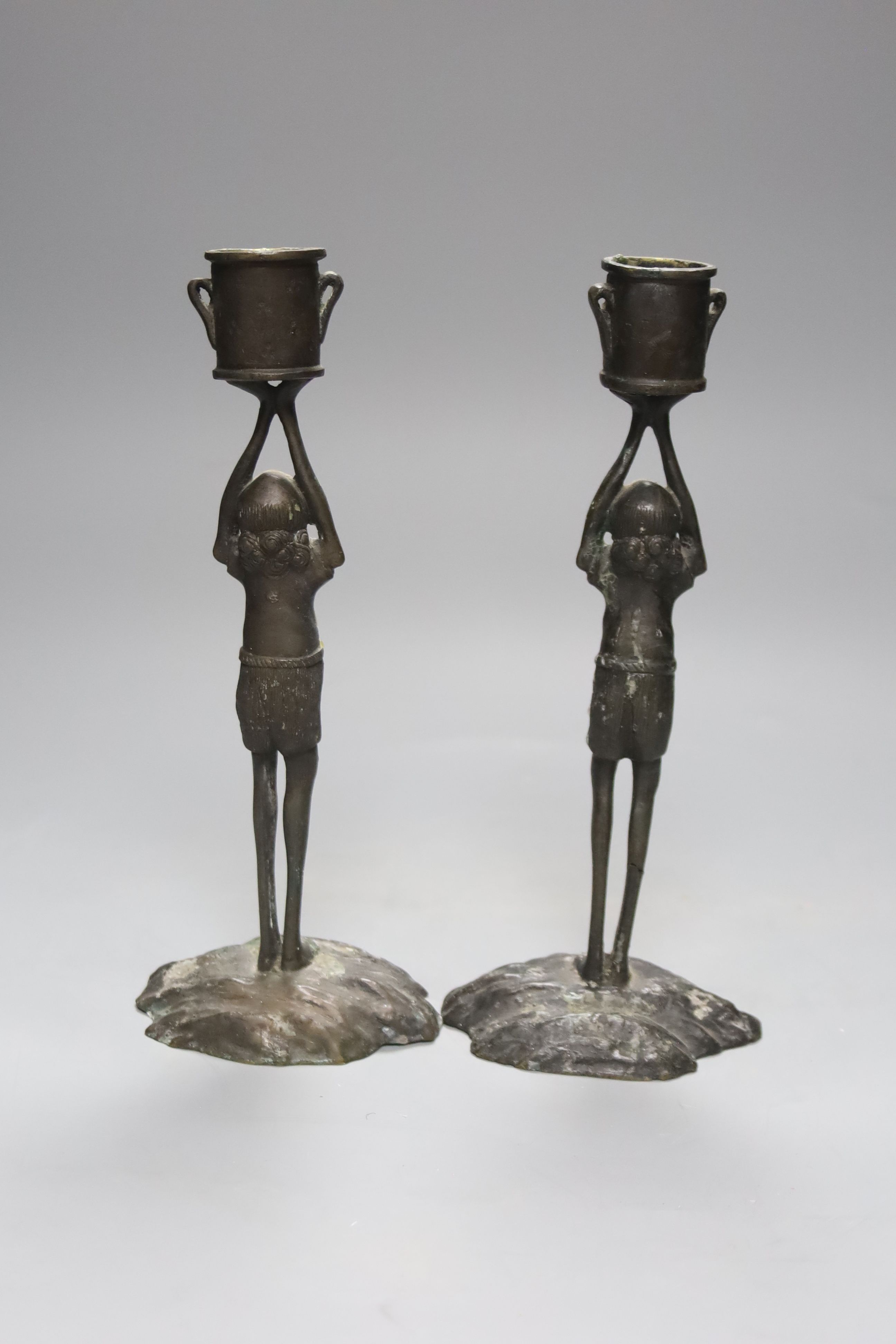 A pair of bronze figural candlesticks, height 24cm